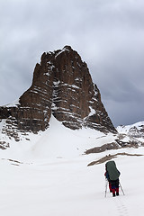 Image showing Two hikers at snowy storm mountains