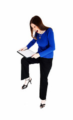 Image showing Woman breaking her clip board.
