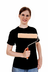 Image showing Woman holding paint roller.