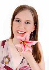 Image showing Girl with pink lily.