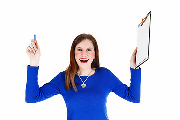 Image showing Woman holding clip board.