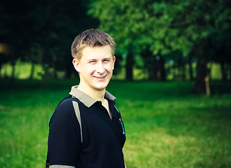 Image showing Headshot Of A Young Man Smiling At Camera In Park