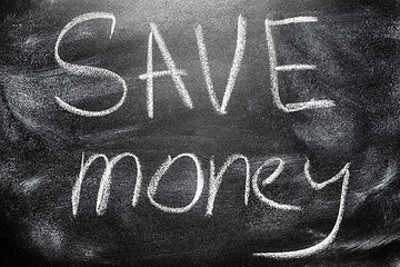Image showing Handwritten message on chalkboard writing message Save Money