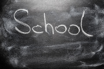 Image showing Handwritten message on chalkboard writing message School