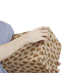 Image showing Young man holding a present