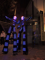 Image showing Illuminated street performers,  stilt walkers for Sydney Vivid a