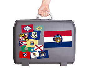 Image showing Used plastic suitcase with stains and scratches