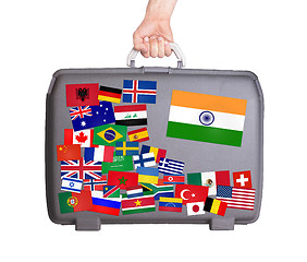 Image showing Used plastic suitcase with stickers