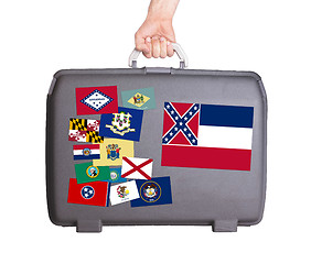 Image showing Used plastic suitcase with stains and scratches