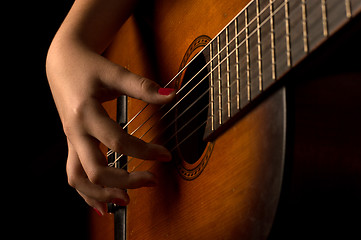 Image showing Girl playing a guitar