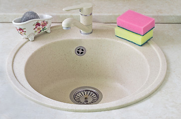 Image showing Sink for ware from metal ceramics and a sponge for washing.