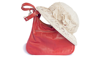 Image showing Female summer hat for protection against the sun and a bag on a 