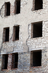 Image showing Wall of old destroyed house with broken windows