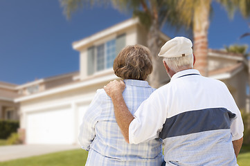 Image showing Happy Senior Couple Looking at Front of House