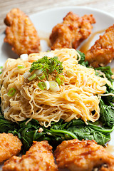 Image showing Chicken Wings with Noodles and Spinach