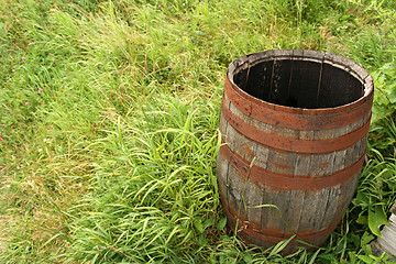 Image showing Wooden barrel in grass