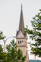 Image showing church steeple seen in a city