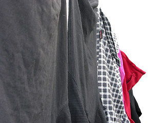 Image showing Clothesline with some laundered clothes on white