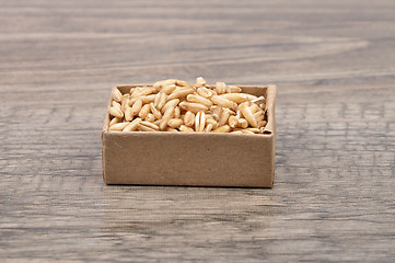 Image showing Oats on wood