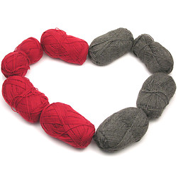 Image showing Gray and red new wool as heart on white background