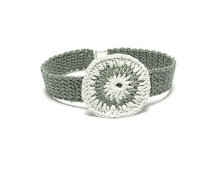 Image showing Hand worked crocheted collar with white and grey crocheted ring