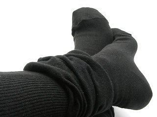 Image showing Feet in black, plump and long stockings