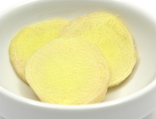 Image showing Ginger in a bowl of chinaware on white