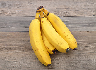 Image showing Bananas on wood