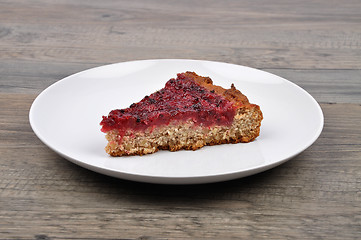 Image showing Red currant cake on wood