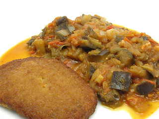 Image showing Breaded bean curd cutlet with fried vegetable on a white plate