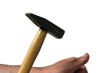 Image showing Man bangs with a hammer on his thumb