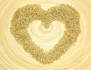 Image showing Bamboo plate with heart out of grain 