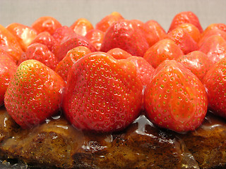 Image showing Lateral close-up view of a strawberry cake on gray background