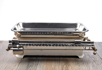 Image showing Old kitchen scales on wood