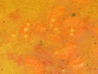 Image showing Close-up view on a soup with carrots and sorghum