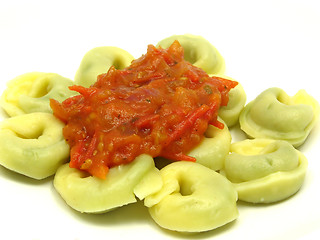 Image showing Stuffed noodles with tomato sauce in a close-up view 