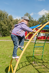 Image showing Playful girl on stair