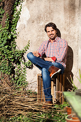 Image showing Male model sitting with legs crossed