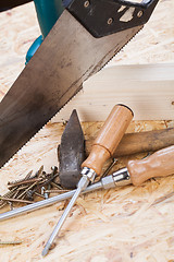 Image showing Drill with timber, screwdrivers and screws