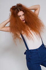 Image showing Female model playing with frizzy hair