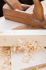 Image showing Handheld wood plane with wood shavings