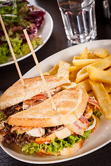 Image showing Club sandwich with potato French fries