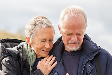 Image showing happy elderly senior couple walking on beach