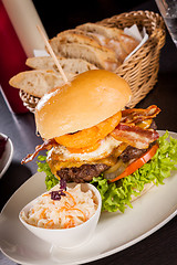 Image showing Delicious egg and bacon cheeseburger