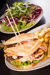 Image showing Club sandwich with potato French fries