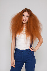 Image showing Female model playing with frizzy hair