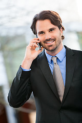 Image showing Businessman listening to a call on his mobile