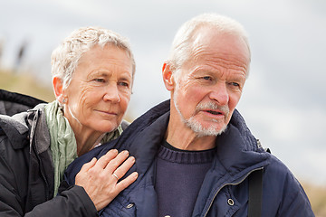 Image showing happy elderly senior couple walking on beach