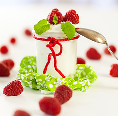 Image showing Raspberries and yoghurt or clotted cream