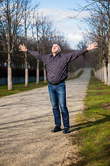 Image showing Middle-aged man enjoying the sunshine